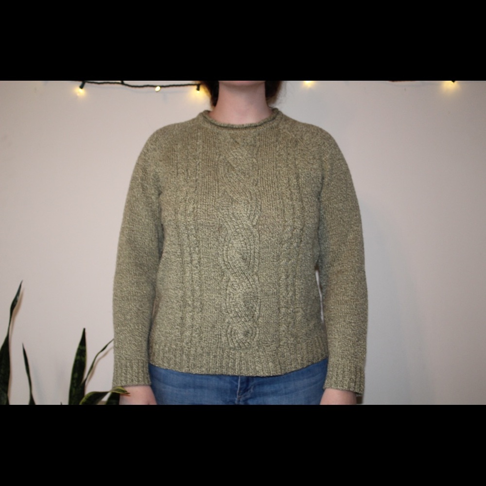 Knit sweater with crisscross pattern on front